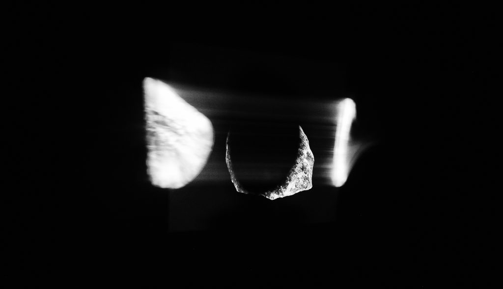 Blurred black and white image of rock like objects