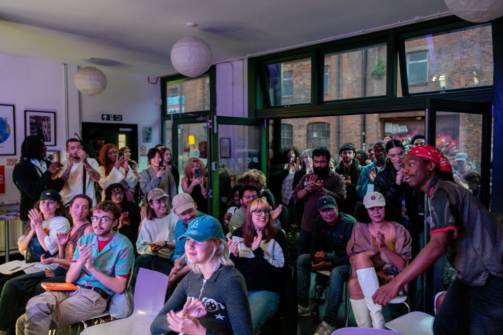View of applauding audience, seated and stanging