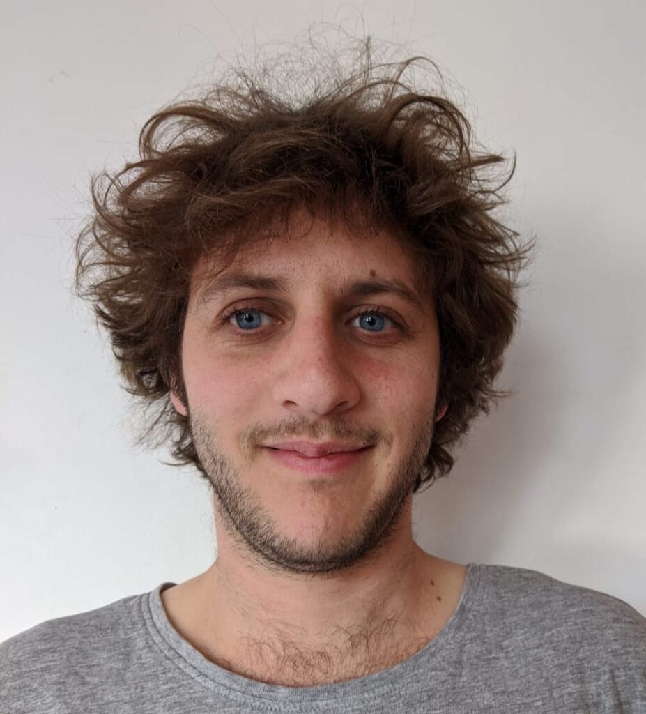 Headshot of Lorenzo in front of a plain background