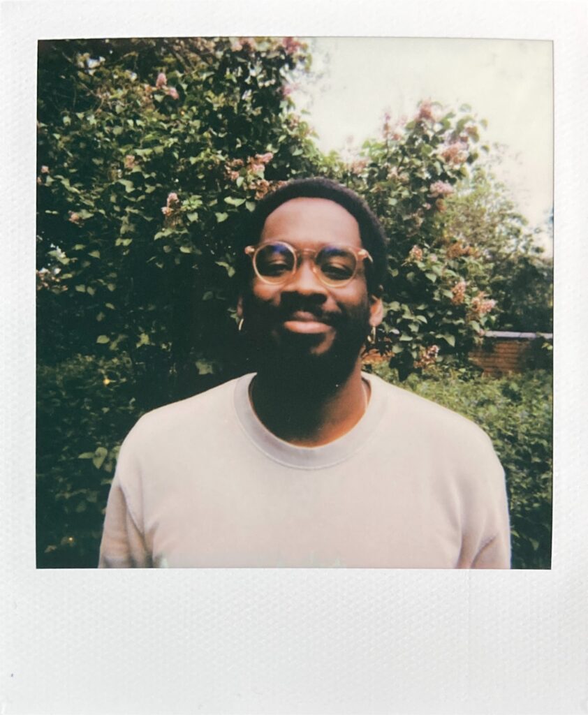 Headshot Polaroid photo of Marley outdoors